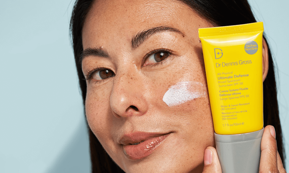 Woman using All-Physical Ultimate Defense SPF 50 by Dr Dennis Gross Skincare