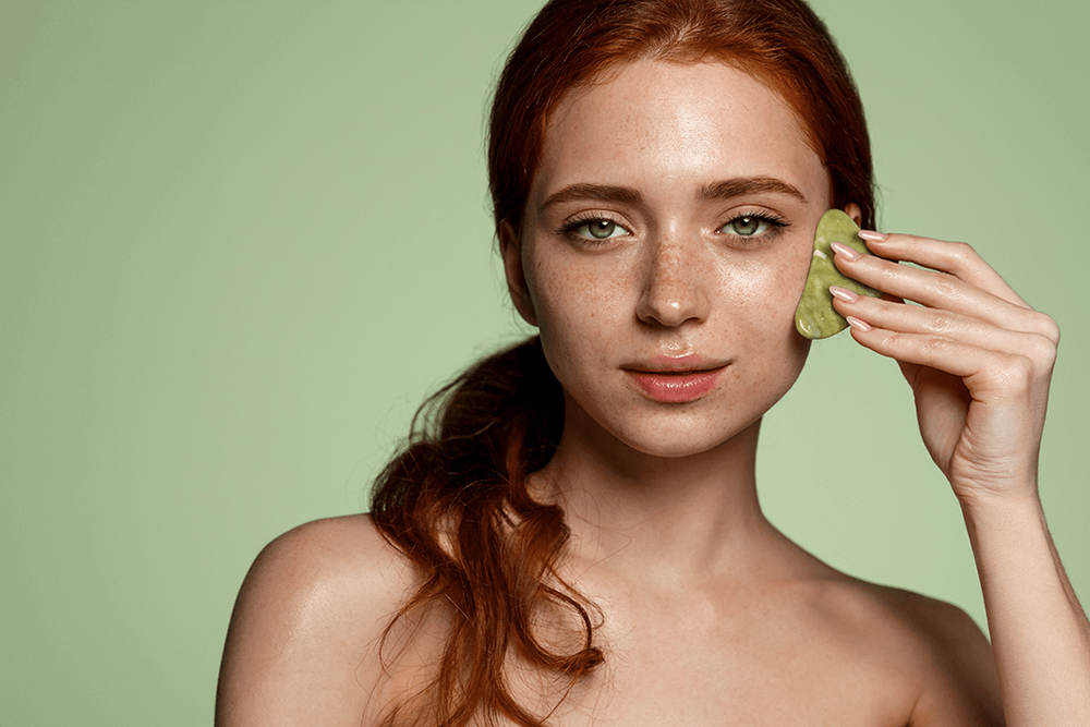 How to Use a Gua Sha to De-Puff